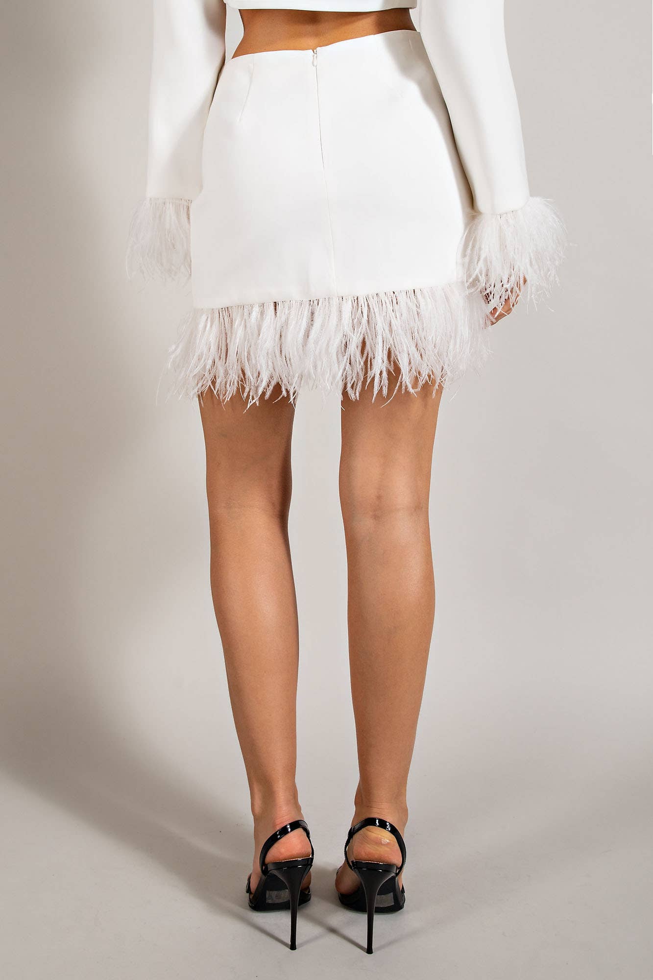 MINI SKIRT W/ FEATHER TRIM & HIDDEN BACK ZIPPER CLOSU